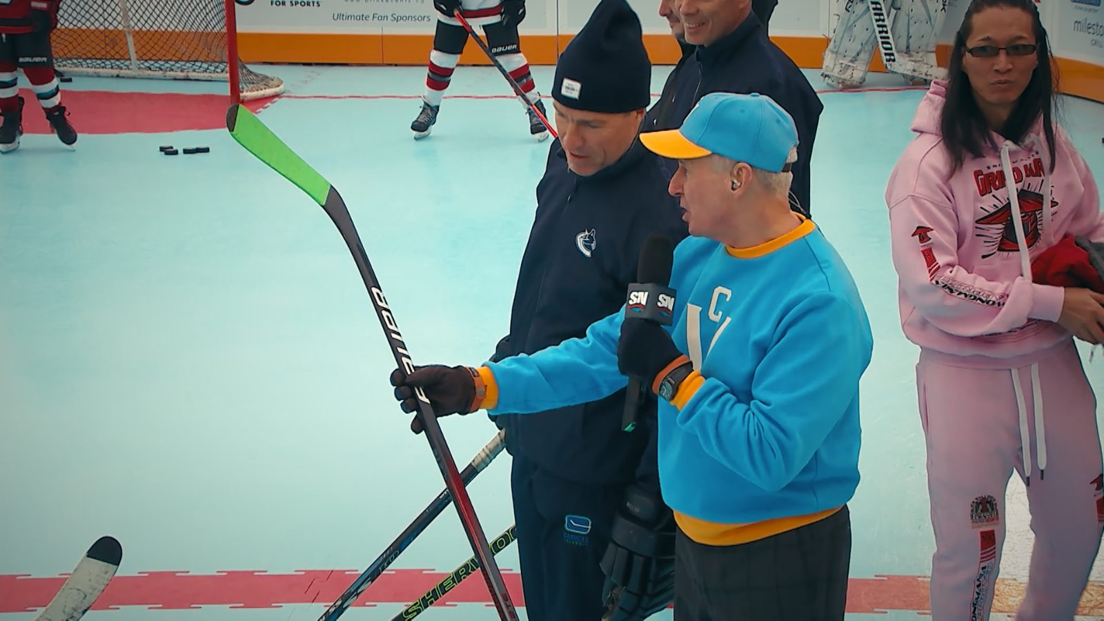 Stu Gershman on the rink with a microphone
